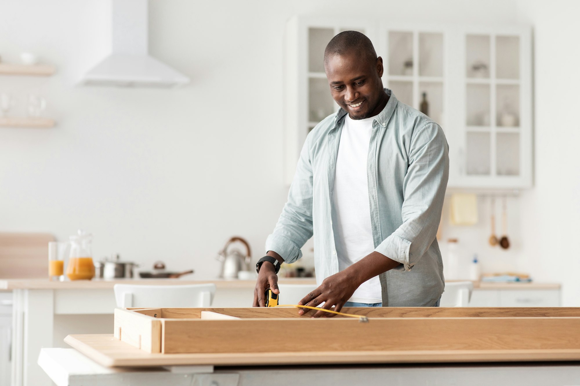 Handyman working at home, repairing, assembling and renovation or new hobby. Man measuring new table