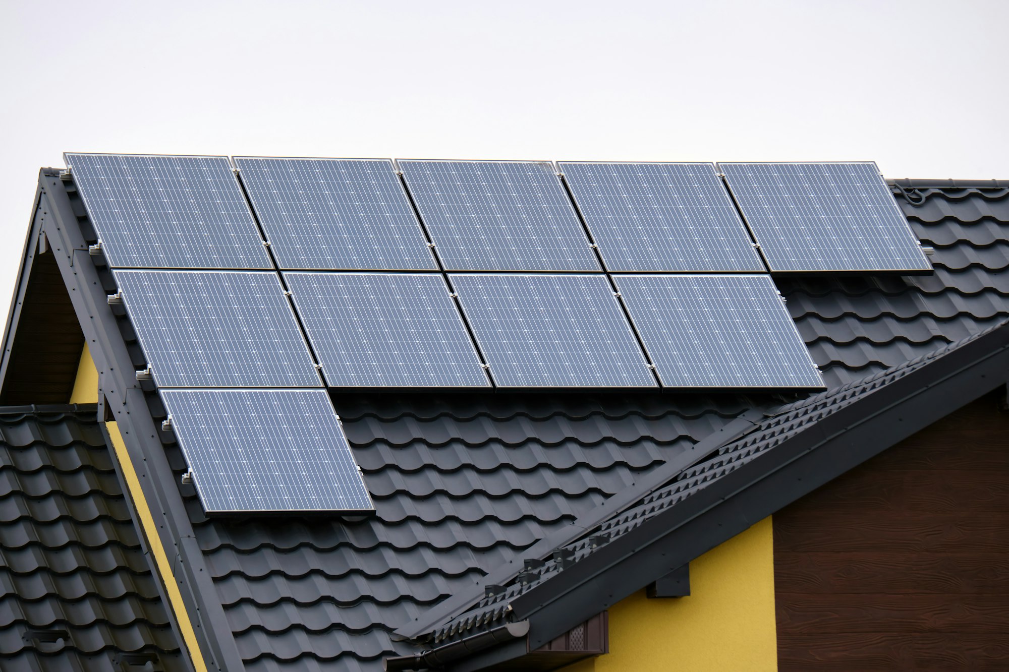 Private home roof covered with solar photovoltaic panels for generating